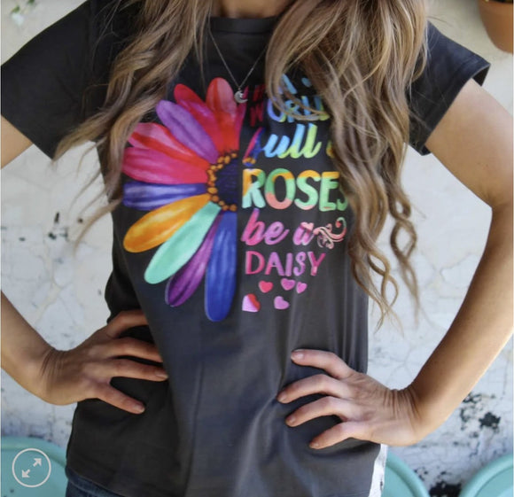 In A World Full of Roses Be a Daisy Tee